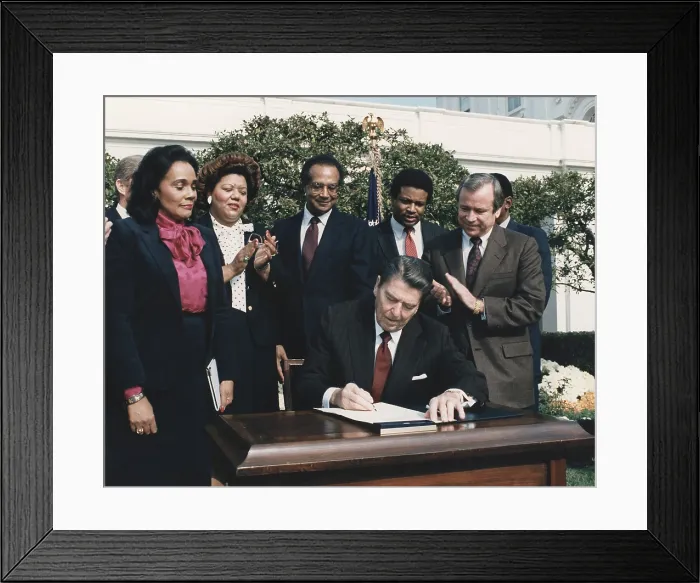 Framed Print : President Reagan signing House Resolution officially dedicating Martin Luther King's birthday as a legal public Holiday. At left is King's widow Cornelia