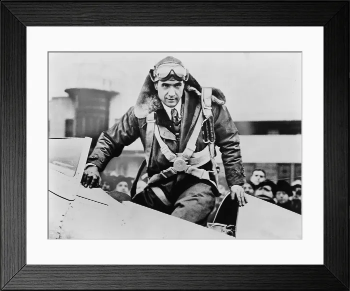 Framed Print : Howard Hughes emerging from an airplane cockpit on his arrival at Newark Airport 7 hours and 28 minutes after leaving from Los Angeles