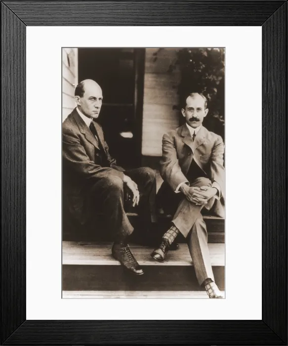 Framed Print : Wilbur Wright and Orville Wright on the porch steps of their house in Dayton Ohio. 1909. LC-USZ62-65478