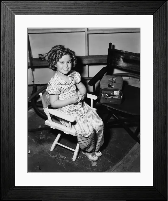 Framed Print : POOR LITTLE RICH GIRL, Shirley Temple, learning to sew on-set, 1936, 20th Century-Fox Film Corporation, TM & Copyright / courtesy Everett Collection Framed Print : POOR LITTLE RICH GIRL, Shirley Temple, learning to sew on-set, 1936, 20th Century-Fox Film Corporation, TM & Copyright / courtesy Everett Collection