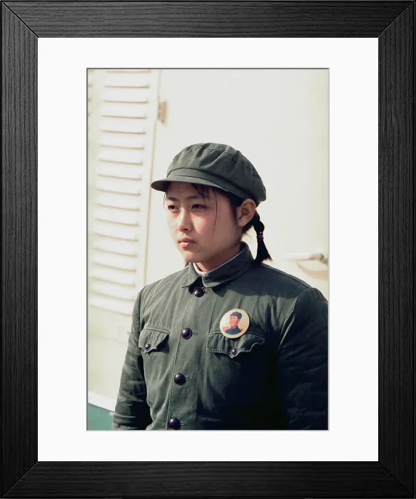 Framed Print : Nixon in China. Young Chinese girl dressed in soldier attire and a portrait pin of Mao at the arrival ceremonies at Beijing for the press plane during Nixon's trip to China Framed Print : Nixon in China. Young Chinese girl dressed in soldier attire and a portrait pin of Mao at the arrival ceremonies at Beijing for the press plane during Nixon's trip to China