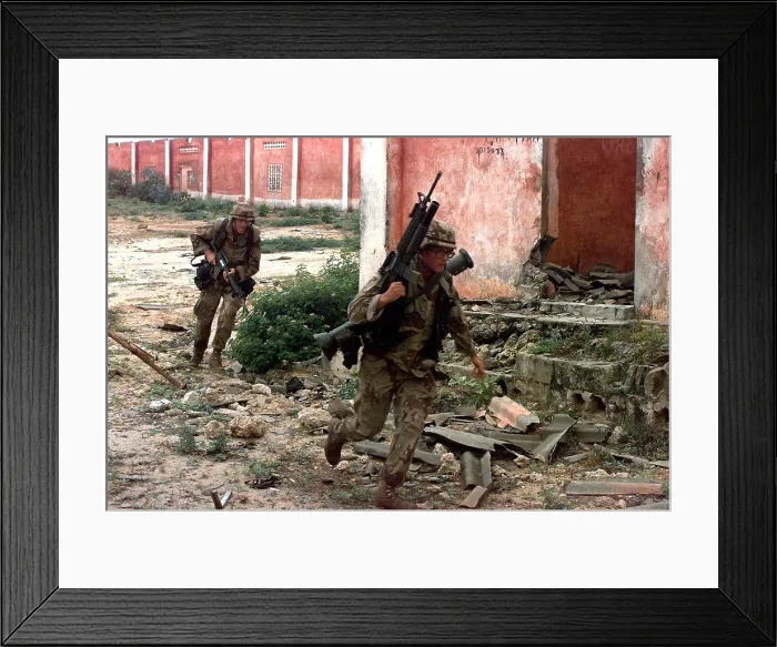 Framed Print : U.S. Marines running from sniper fire in Mogadishu Somalia during the troubled U.N. humanitarian intervention. Jan. 7 1992. (BSLOC_2011_3_30) Framed Print : U.S. Marines running from sniper fire in Mogadishu Somalia during the troubled U.N. humanitarian intervention. Jan. 7 1992. (BSLOC_2011_3_30)