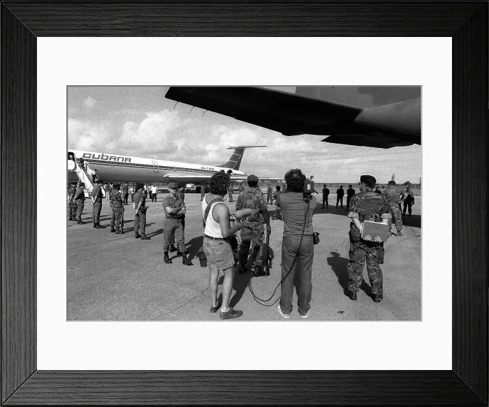 Framed Print : U.S. Air Force security police guard Cuban nationals as they board the airliner returning them to Cuba. The Cuban presence influenced to U.S. invasion of Grenada on Oct. 25 1983