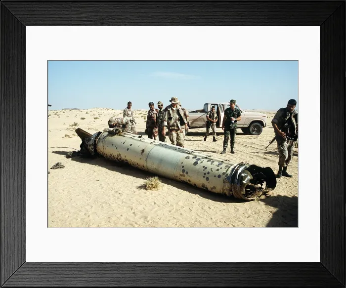 Framed Print : Military personnel examine a Scud missile shot down by an Patriot air defense missile during Operation Desert Storm. May 26 1992. (BSLOC_2011_3_36)