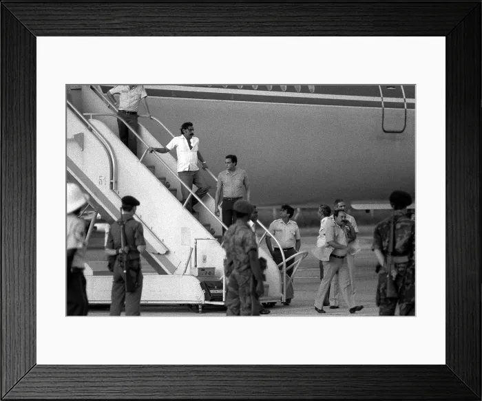 Framed Print : U.S. Air Force security police guard Cuban nationals as they board the airliner returning them to Cuba Framed Print : U.S. Air Force security police guard Cuban nationals as they board the airliner returning them to Cuba