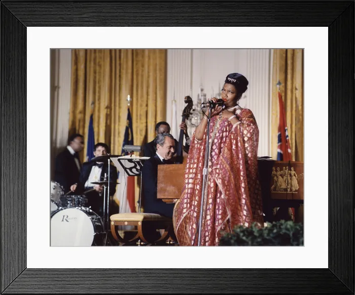 Framed Print : Nixon at the Piano. Pearl Bailey sings after a White House dinner while accompanied by President Nixon. March 7 1974