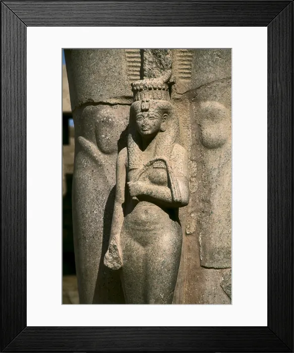 Framed Print : Great Temple of Amon-Re. 16th-4th c. BC. EGYPT. Karnak. Thebes. Temple of Amon - Ra. The Goddess Hathor. Sculpture situated at the feet of a colossal sculpture of Ramses II