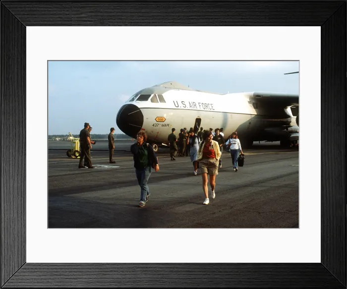 Framed Print : Women American medical students exit a U.S. Air Force transport from Grenada on Nov. 3 1983