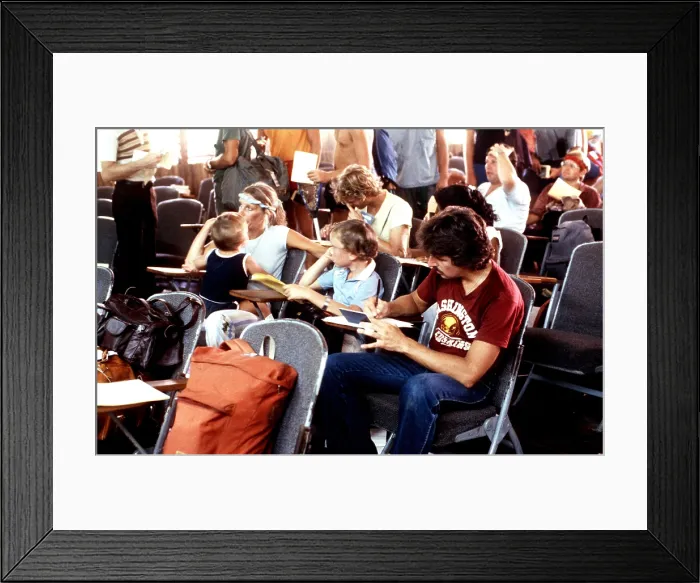 Framed Print : U.S. civilians awaiting evacuation from Grenada during the October 1983 U.S. invasion. American medical students were among approximately 800 U.S. citizens on Grenada. Nov 3 1983