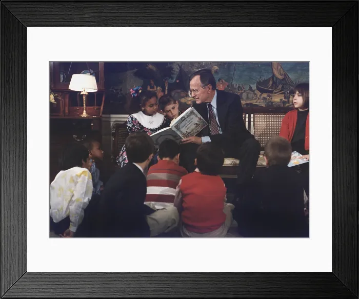 Framed Print : President George H. W. Bush reads A CHILD'S GARDEN OF VERSES to children on the first Great American Read Aloud Day April 19 1991. (BSLOC_2011_3_65)