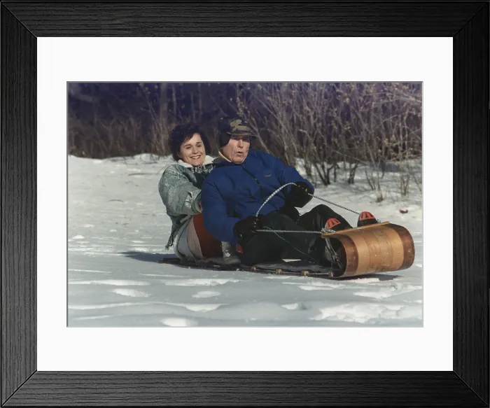 Framed Print : President George Bush goes sledding at Camp David with his daughter Doro. Jan. 13 1991. (BSLOC_2011_3_67) Framed Print : President George Bush goes sledding at Camp David with his daughter Doro. Jan. 13 1991. (BSLOC_2011_3_67)