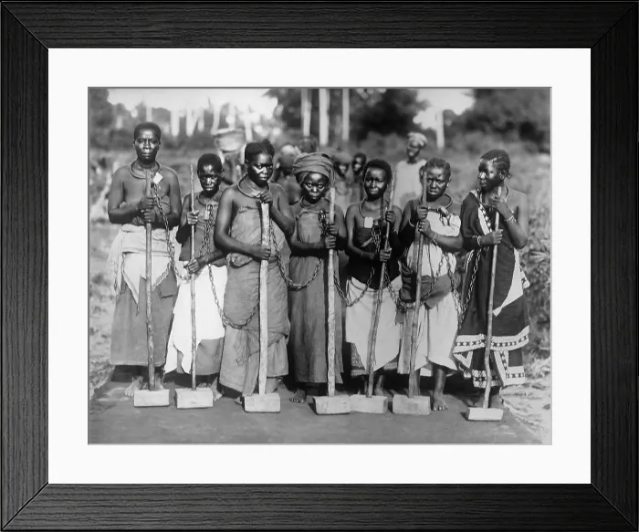Framed Print : Women convicts working on road while chained together by neck rings in Tanganyika, East Africa ca. 1915