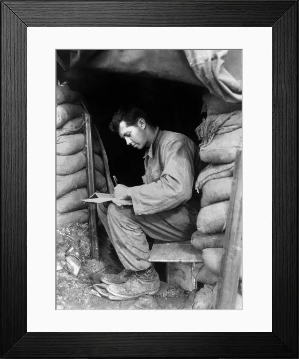 Framed Print : U.S. soldier writes a letter during a break along the fighting front in Korea. Nov. 15, 1951. Korean War, 1950-53. (BSLOC_2014_11_148)