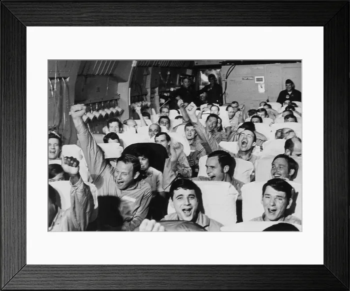 Framed Print : Cheering American POWs. American servicemen cheer as their aircraft takes off from an airfield near Hanoi after their release at the end of the Vietnam War. Ca. Feb Framed Print : Cheering American POWs. American servicemen cheer as their aircraft takes off from an airfield near Hanoi after their release at the end of the Vietnam War. Ca. Feb