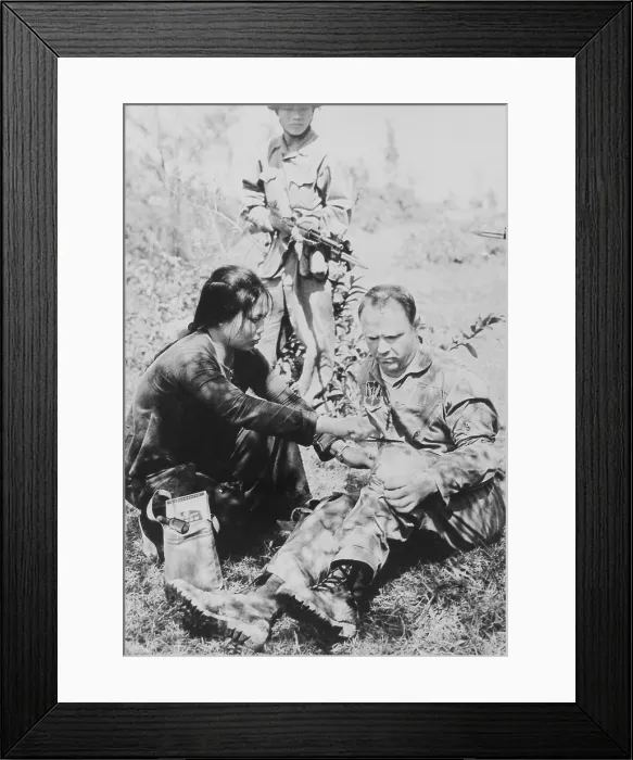 Framed Print : US Air Force Captain Wilmer Newk Grubb is given first aid by his captors in North Vietnam. He was taken prisoner after ejecting over North Viet Nam on Jan