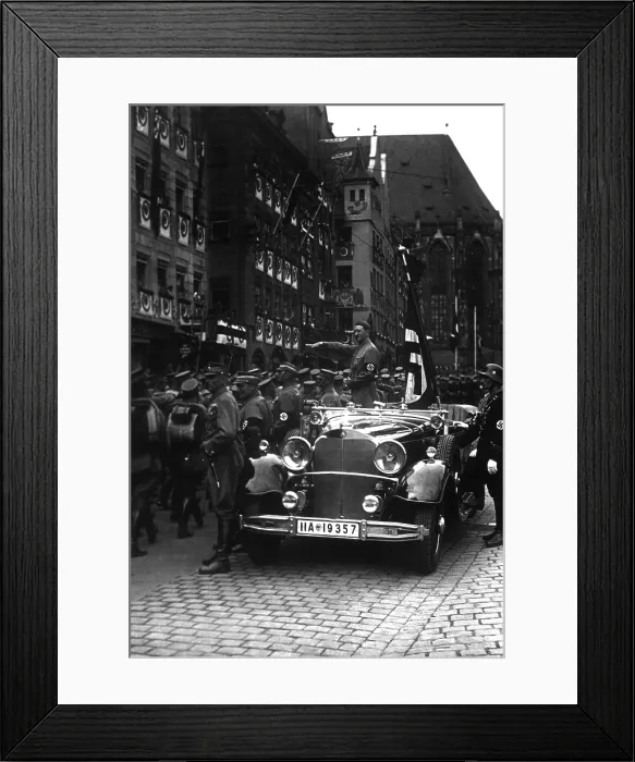 Framed Print : Adolf Hitler salutes parading Nazi Party storm troopers in Nuremberg, Nov. 5, 1935. (BSLOC_2013_11_11)