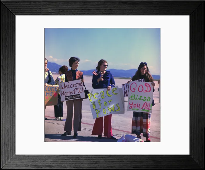 Framed Print : Wives welcome home US Marine POWs. Marine wives wait with signs for their husbands who were released in Hanoi, North Vietnam, on Feb. 12, 1973