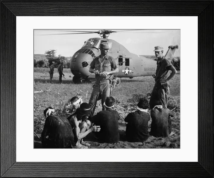 Framed Print : Six Viet Cong POWs. US Marines guard prisoners taken during search and destroy operation, in which 599 of their compatriots were killed