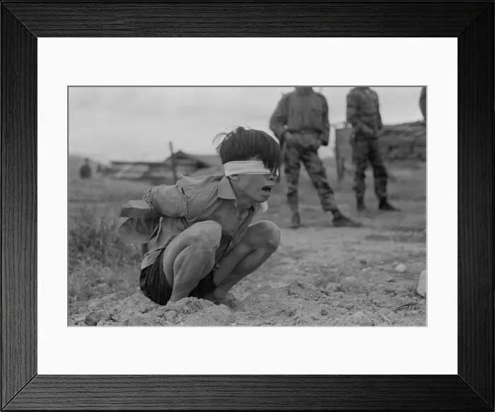 Framed Print : Viet Cong prisoner of war. A terrified VC prisoner awaiting interrogation unit of special forces A-109 Thuong Duc, 25 kilometers west from Da Nang, Vietnam. Jan. 23, 1967