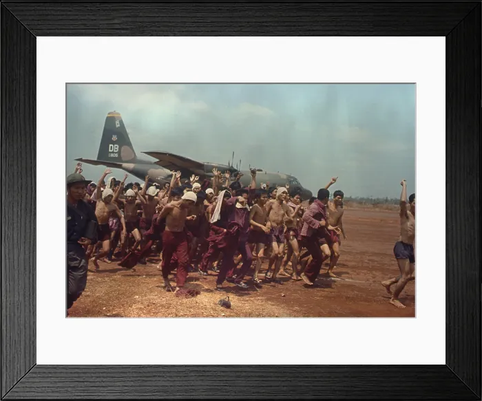 Framed Print : ARVN Prisoner of War Repatriation. South Vietnamese freed POWs shed their prison uniforms and shout political slogans after their repatriation. March 13, 1973 Framed Print : ARVN Prisoner of War Repatriation. South Vietnamese freed POWs shed their prison uniforms and shout political slogans after their repatriation. March 13, 1973