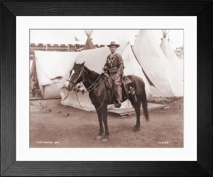Framed Print : Calamity Jane (1852-1903), posing on horseback. She gained fame in the 1870s and later toured in Wild West shows. Ca. 1885