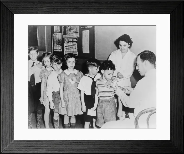 Framed Print : School children waiting in line for immunization shots at a child health station in New York City, N.Y. 1943 Framed Print : School children waiting in line for immunization shots at a child health station in New York City, N.Y. 1943