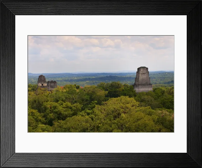 Framed Print : GUATEMALA. Tikal. Tikal National Park. View of the temples I, II and IV standing out the rainforest. Maya art. Architecture