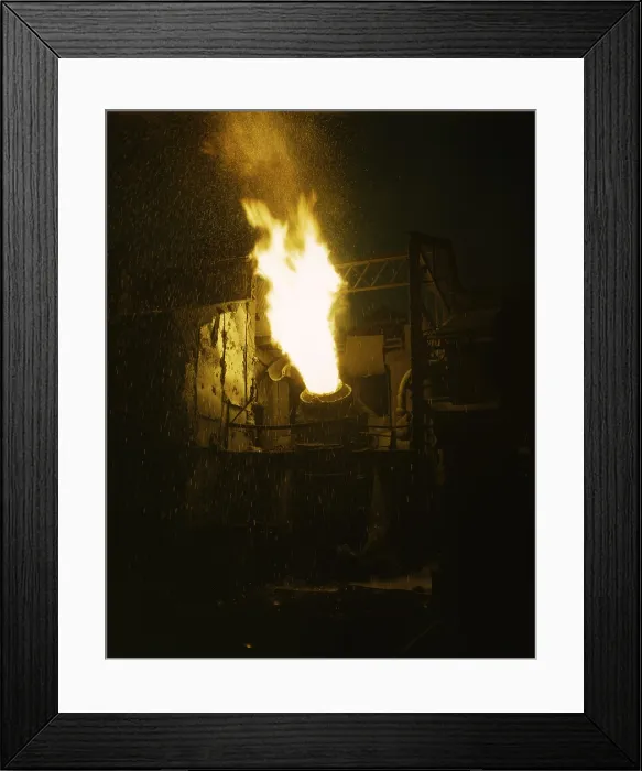 Framed Print : Molten iron is blown in an Eastern Bessemer converter at the Republic Steel mill in Youngstown, Ohio. November 1941