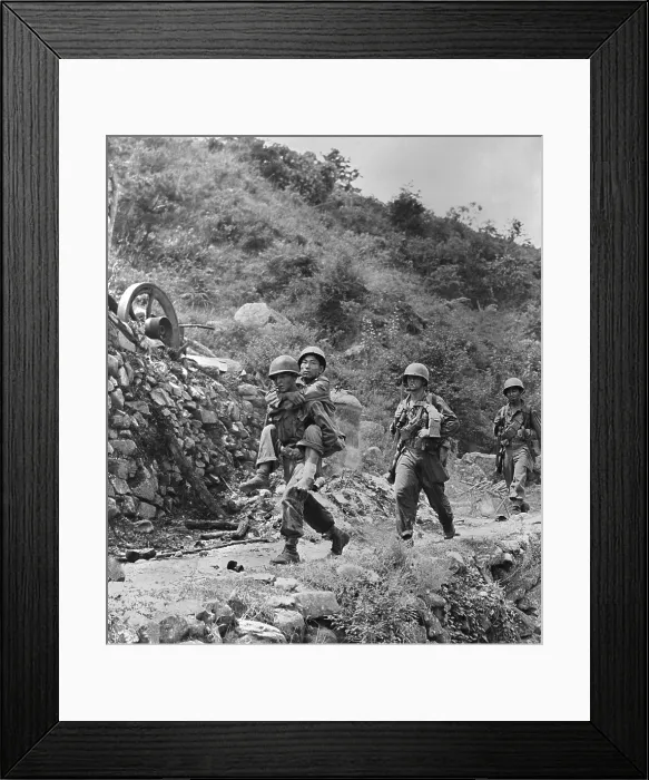 Framed Print : Wounded South Korean soldier carried to a first aid station by a U.S. infantryman. Korean War, 1950-53, (BSLOC_2014_11_161)