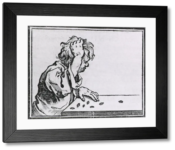 Framed Print : Human hair lice. Male youth seated at a table, combing the lice out of his hair. Woodcut from HISTORIA MEDICA, published in Brussels in 1639 Framed Print : Human hair lice. Male youth seated at a table, combing the lice out of his hair. Woodcut from HISTORIA MEDICA, published in Brussels in 1639