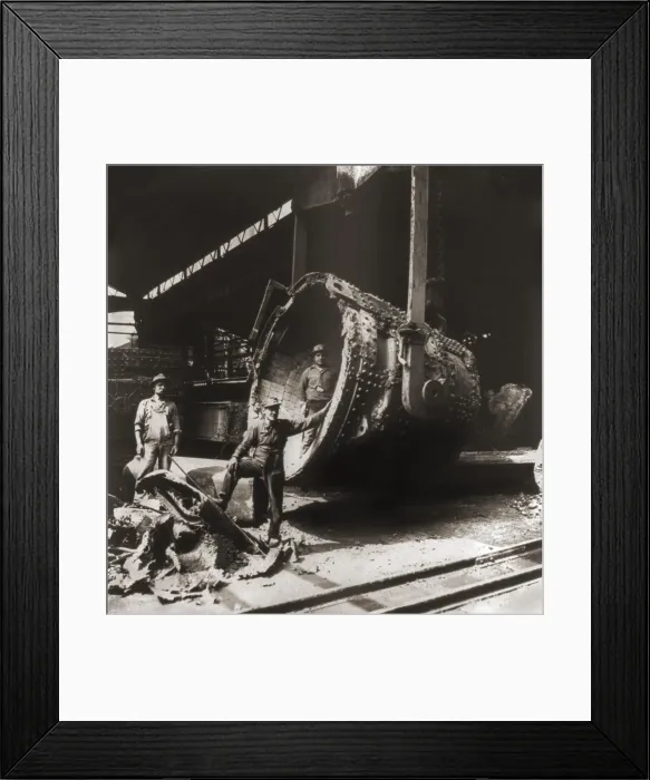Framed Print : Cleaning and repairing the clay lined ladle, that holds molten iron and steel at a Pittsburgh, Pennsylvania steel works. 1905
