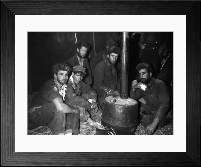 Framed Print : Released American and Australian POWs warming up by a stove. They are in the 24th Division medical clearing station after being returned to U.S Framed Print : Released American and Australian POWs warming up by a stove. They are in the 24th Division medical clearing station after being returned to U.S