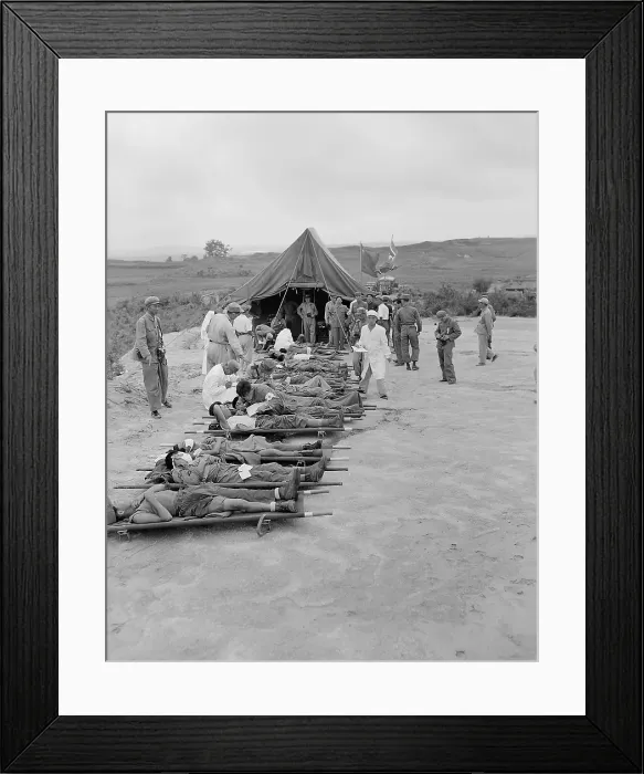Framed Print : Litter cases of North Korean War POWs are exchanged during Operation Little Switch. They are at the Communist receiving center at Panmunjom, Korea. April-May, 1953
