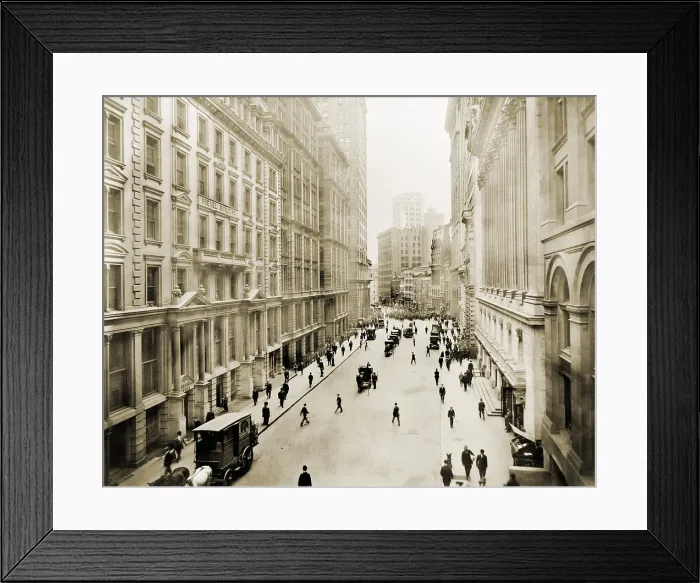 Framed Print : View down Broad street from its intersection with Wall Street. At right are the columns of the New York Stock Exchange Framed Print : View down Broad street from its intersection with Wall Street. At right are the columns of the New York Stock Exchange