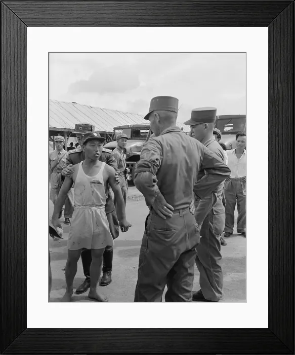 Framed Print : Communist POW verbally abuses an American Army Major during the UN POW exchange