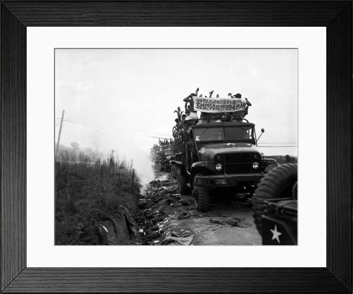 Framed Print : Released Communist POWs in trucks ripped off their foreign clothing and threw it away
