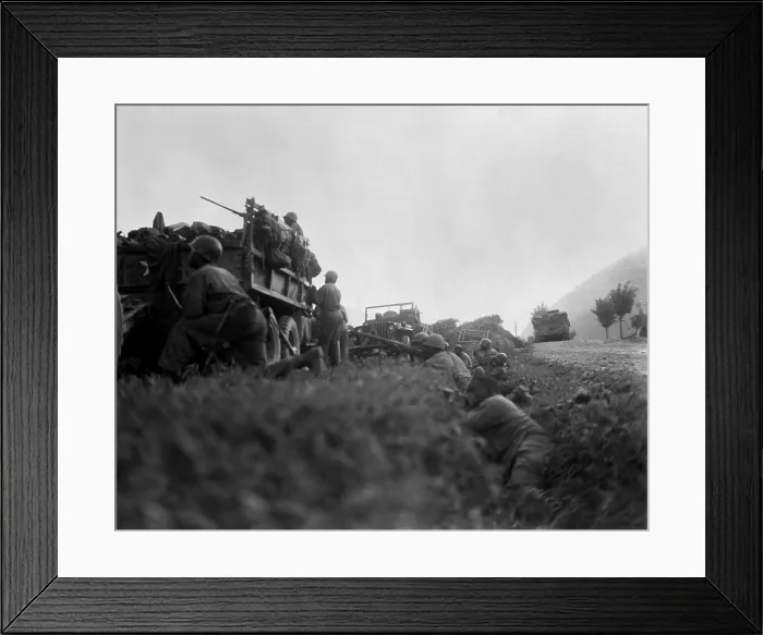 Framed Print : U.S. troops shelter in a ditch while under fire from North Korean invaders, during the Defense of the Pusan Perimeter. Ca. Aug. 1950. Korean War, 1950-53. (BSLOC_2014_11_18)