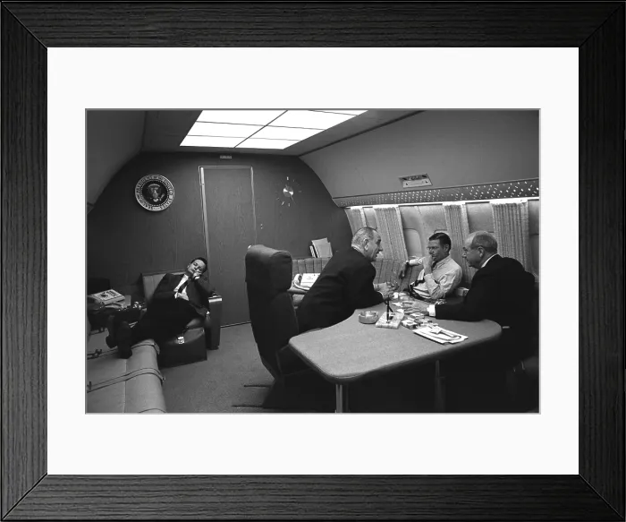 Framed Print : Bill Moyers naps in a chair on Air Force One. Traveling to a summit meeting on the Vietnam War in Honolulu, President Johnson talks with Robert McNamara and Dean Rusk. Feb Framed Print : Bill Moyers naps in a chair on Air Force One. Traveling to a summit meeting on the Vietnam War in Honolulu, President Johnson talks with Robert McNamara and Dean Rusk. Feb