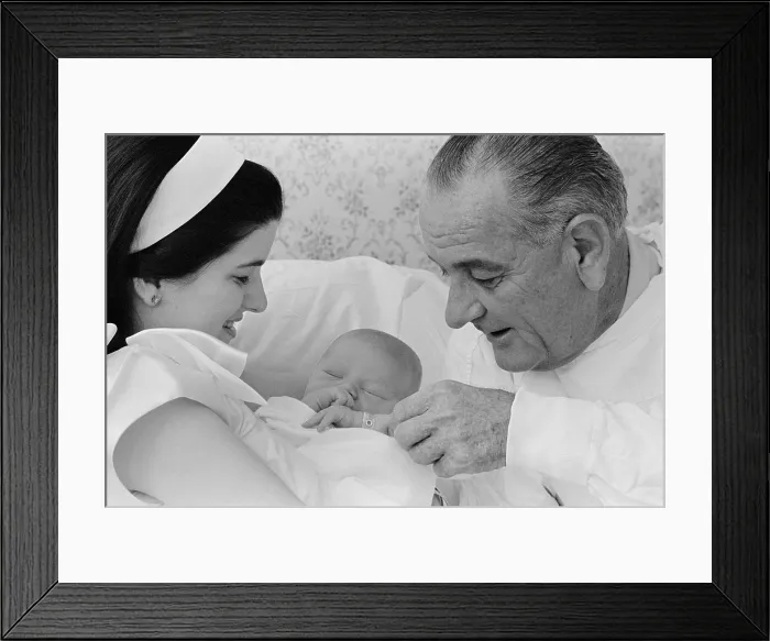 Framed Print : President Lyndon Johnson's first grandchild. Sleeping in his mother Luci's arms, Patrick Lyndon Nugent was born on June 21, 1967 at Seton Hospital, in Austin, Texas