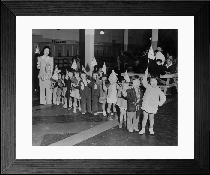 Framed Print : Japanese-American youngsters carry flags in Americanization program at the Santa Anita Assembly Center