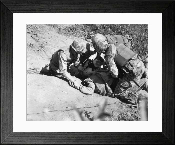 Framed Print : U.S. Marine is given a drink of water as he waits for evacuation to a rear area aid station. Nov. 1952 Framed Print : U.S. Marine is given a drink of water as he waits for evacuation to a rear area aid station. Nov. 1952