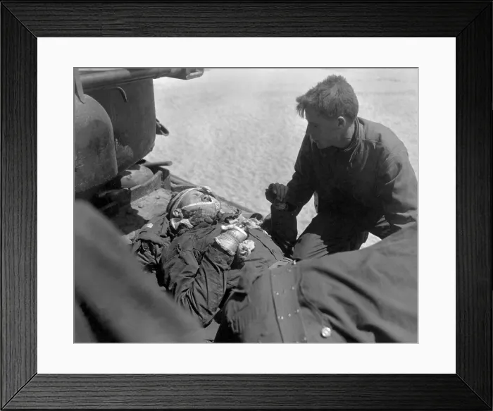 Framed Print : Wounded, but alert, U.S. soldier in an outboard stretcher-basket attached to rescue helicopter Framed Print : Wounded, but alert, U.S. soldier in an outboard stretcher-basket attached to rescue helicopter