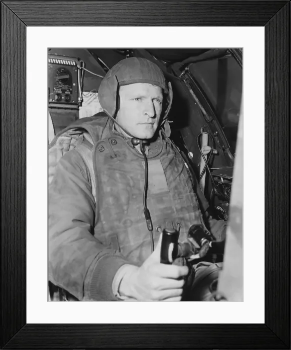 Framed Print : Air Force pilot at the controls of his B-29 just prior to take-off on a mission in North Korea. He wears 105 pounds of flight gear necessary for combat missions