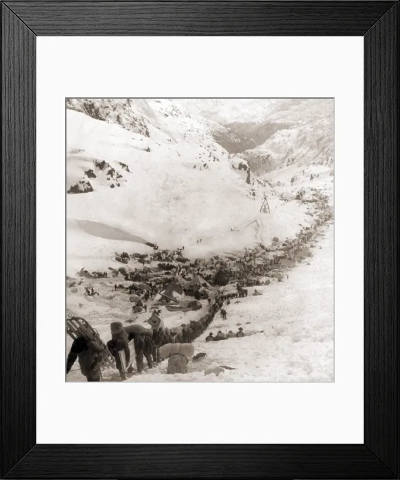 Framed Print : Long ribbon of miners bound for the Klondike gold fields climbing over the Chilcoot Pass, in 1898