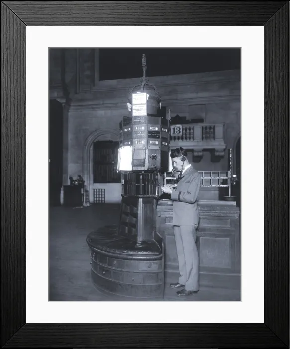 Framed Print : High technology in 1928 was the NY Stock Exchange's new quotation system. Photo shows a telephone operator, with headphones and mouthpiece at his post on the trading floor