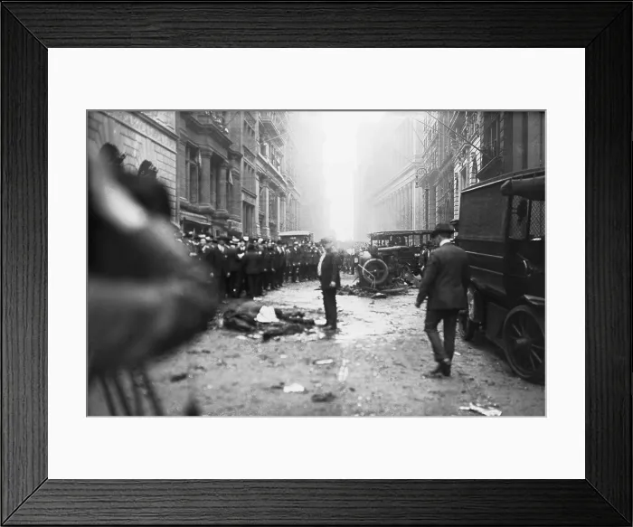 Framed Print : The Wall Street Bombing. A man stands over a dead horse, after the explosion in front of J.P. Morgan & Co. office at Broad and Wall Streets Framed Print : The Wall Street Bombing. A man stands over a dead horse, after the explosion in front of J.P. Morgan & Co. office at Broad and Wall Streets