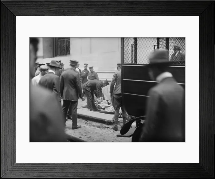 Framed Print : The Wall Street Bombing. Police and soldiers attend to the dead and injured after the Wall Street terrorist bombing, Sept. 16, 1920, in the New York City financial district