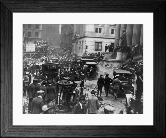 Framed Print : The Wall Street Bombing. Overturned automobile, smoke, and debris from explosion in front of a Federal Hall at Broad and Wall streets in New York City on September 16, 1920