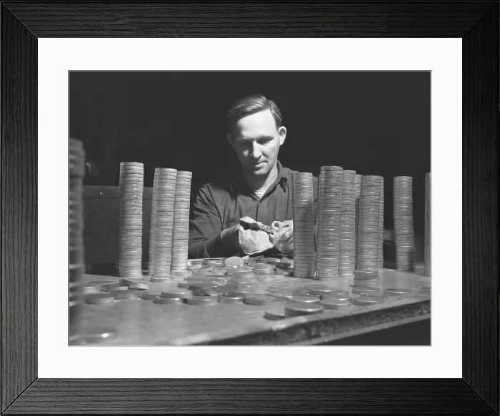 Framed Print : Circular blanks of copper and crass inspected for flaws in metal structure before they become shell casings for the U.S. in World War II Framed Print : Circular blanks of copper and crass inspected for flaws in metal structure before they become shell casings for the U.S. in World War II