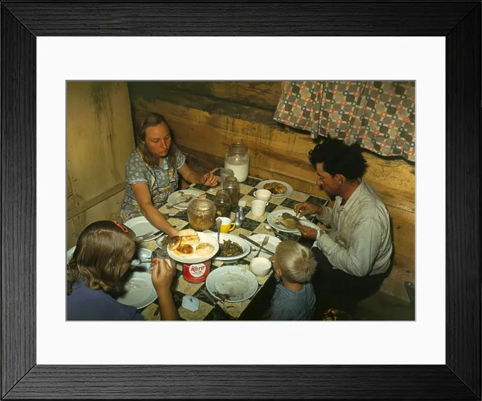 Framed Print : Faro Caudill's family dinner in their dugout home in Pie Town New Mexico. They were among 250 homesteaders families who migrated from the Dust Bowl